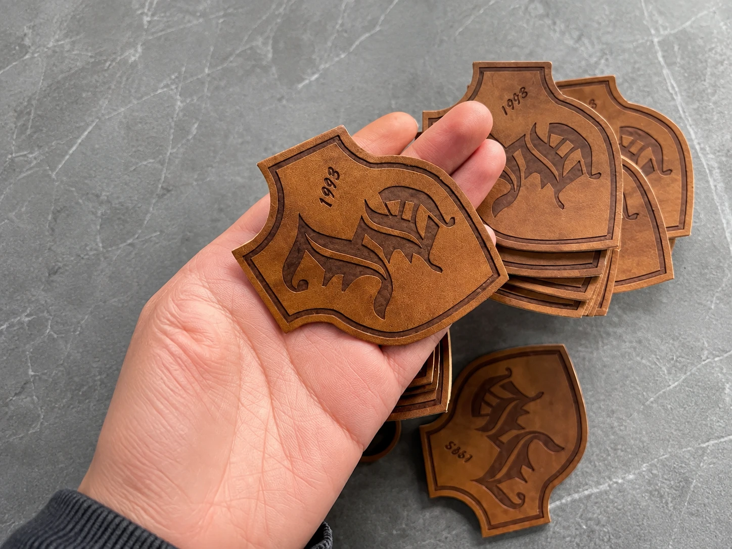 Custom leather patches applications on apparel and accessories